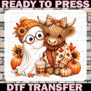 May include: A DTF transfer sheet featuring a white ghost wearing an orange beanie and glasses, standing next to a fluffy highland cow in a plaid sweater and bow. The scene includes sunflowers, pumpkins, and a coffee cup, with text READY TO PRESS.