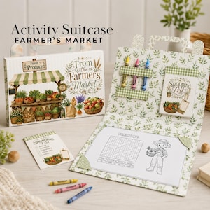May include: A Farmer's Market activity suitcase featuring a cardboard case with a produce stand illustration, a matching open folder with three crayons, a shopping list notepad, and a farm life word search sheet with a child character illustration.