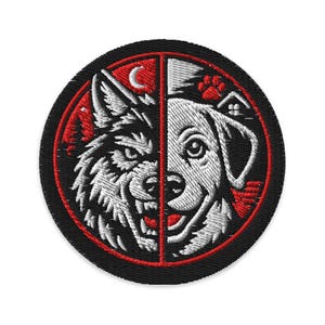 May include: Embroidered patch featuring a split design of a wolf and a dog. The wolf side is white and black with red accents, and the dog side is white with black accents. The patch is round with a black border and red inner circle.