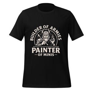 May include: Black t-shirt featuring a white graphic of a Viking holding a paintbrush and a miniature figure. The text reads "BUILDER OF ARMIES" and "PAINTER - OF MINIS-". The design is centered on the front of the short-sleeved shirt.