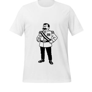 May include: White t-shirt featuring a black and white illustration of a stern-looking man in a military-style uniform. The graphic includes a large mustache, medals, and a sash. The man is standing with his hands on his hips.
