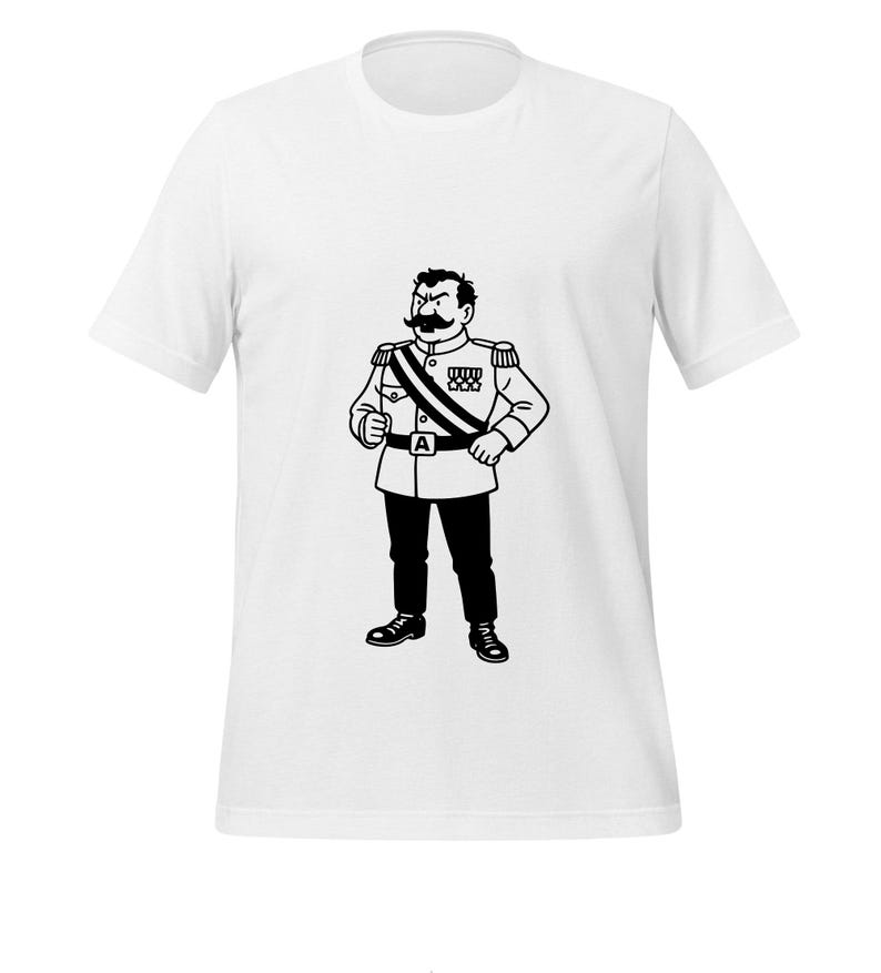 May include: White t-shirt featuring a black and white illustration of a stern-looking man in a military-style uniform. The graphic includes a large mustache, medals, and a sash. The man is standing with his hands on his hips.