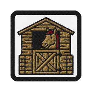 May include: Embroidered patch featuring a horse peeking out of a wooden stable. The horse has a brown coat and a red mane. The stable is made of brown wood with a black border.