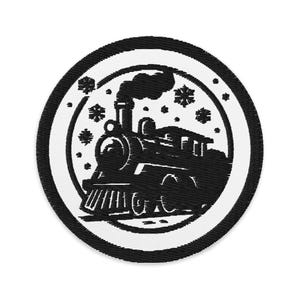 May include: Black and white embroidered patch featuring a vintage steam train with smoke billowing from its smokestack. The train is surrounded by snowflakes, set against a white background with a black border.