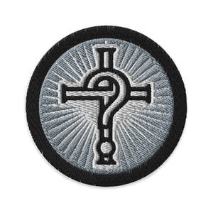 May include: Embroidered patch featuring a stylized cross intertwined with a question mark. The design is in white and black, set against a light gray radial burst background, and framed by a black border. This patch is suitable for jackets, bags, or other fabric items.