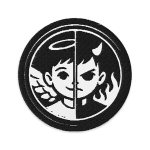 May include: A round, black and white patch featuring a split design. One half depicts an angel with a halo and wings, the other a devil with horns and flames. The patch is embroidered with a detailed, contrasting design.