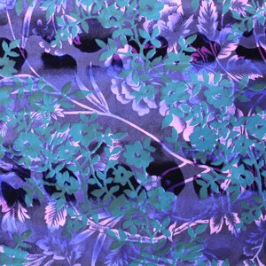 May include: A purple and teal floral fabric with a repeating pattern of stylized flowers and leaves.