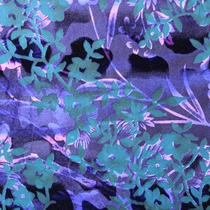 May include: A purple and teal floral fabric with a repeating pattern of leaves and flowers.