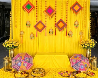 Haldi Backdrop Decoration: Yellow Curtains, Kite & Pom Pom Hangings