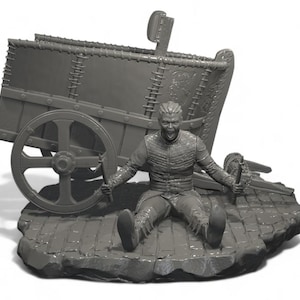 May include: A gray figurine depicting a man seated on a stone base, with a cart behind him. The man is screaming and holding a sword. The cart has large wheels and is detailed with rivets and decorative elements.
