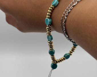 Pulsera de cuentas color turquesa/dorado para teléfono