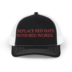 May include: Black and white trucker hat with the text "REPLACE RED HATS WITH RED WORDS" embroidered in red. The hat features a black front panel, a white mesh back, and a curved brim with white stitching.