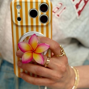 May include: A white ceramic mug with a black handle and the text "But First, Coffee" in a black, bold font. The mug is on a white surface. The mug is approximately 4 inches tall.
