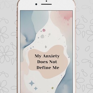 May include: A smartphone displays the text "Emotional Reset Kit" at the top. The screen shows a pastel abstract design with the words "My Anxiety Does Not Define Me". The phone has a white frame.