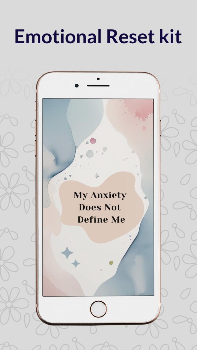 May include: A smartphone displays the text "Emotional Reset Kit" at the top. The screen shows a pastel abstract design with the words "My Anxiety Does Not Define Me". The phone has a white frame.