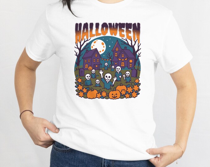 Playful Halloween Tee: Teal Skeletons Rise in a Colorful Graveyard