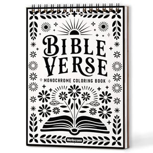 Op de afbeelding: Een spiraalgebonden kleurboek met een zwart-wit ontwerp. De cover toont de woorden "BIBLE VERSE" boven "MONOCHROME COLORING BOOK". Bloemen- en zonnemotieven omringen de tekst. Het boek is open op een blanco pagina.