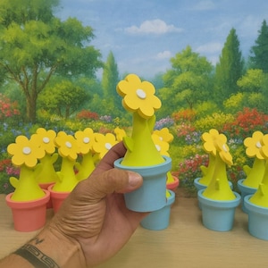 May include: A collection of colorful, whimsical flower pot decorations. Each pot is painted in pastel colors, with a yellow flower and white center. The background features a painted garden scene with trees and flowers.