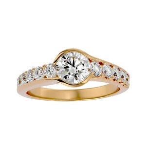 May include: A gold ring with a large, round, clear diamond center stone. Smaller diamonds are set along the band. The ring has a classic, elegant design, perfect for engagement or special occasions.