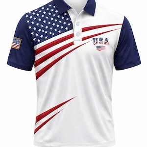 May include: White polo shirt featuring a patriotic design with the American flag. The shirt has a navy blue collar and sleeves, with the flag design on the left shoulder and a stylized USA graphic on the front. The shirt has a button-down placket.