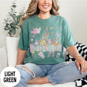 May include: A set of three ceramic mugs with a speckled, matte finish. The mugs are in shades of cream, light gray, and dark gray. Each mug has a simple, minimalist design and a rounded handle.