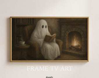 May include: A framed print depicts a ghost reading a book in a cozy armchair by a fireplace. The artwork has a vintage aesthetic with a warm color palette. A small table holds a cup of coffee. The text "FRAME TV ART" and "dandy vintage prints" are at the bottom.