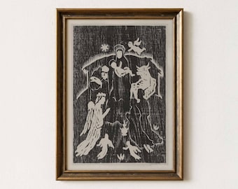 May include: A framed black and white print depicting a nativity scene with figures of Mary, Joseph, baby Jesus, angels, and animals. The print is in a gold-colored frame. The text "dandy vintage prints" is at the bottom.