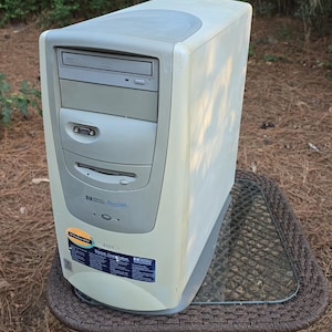 May include: A beige HP Pavilion 8395 desktop computer tower featuring a DVD drive, a floppy disk drive, and a front-facing VGA port. The front panel displays the HP Pavilion logo and a blue informational sticker with the text Discover, Create, Explore.
