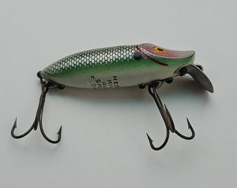 062625 Flotador Vintage Heddon River Runt Spook de 3" Verde Plata Cara Rosa