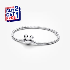 May include: A silver bracelet with a Mickey Mouse-shaped clasp. The bracelet has a snake chain design and is displayed on a white background. The image also includes a "BUY 2 GET 1 FREE" promotional offer.