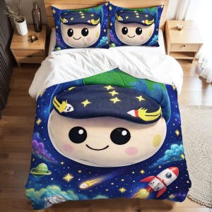 May include: A bedding set featuring a whimsical space-themed design. The duvet cover and two pillowcases display a smiling cartoon character wearing a nightcap with stars. A rocket ship, planets, and a starry sky complete the design.