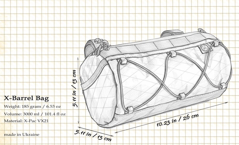 May include: Pencil sketch of an X-Barrel Bag, a cylindrical bag with a diamond pattern and a capacity of 3000 ml. The bag is 10.23 inches long and 5.11 inches in diameter. The bag's weight is 6.53 oz. The material is X-Pac VX21.