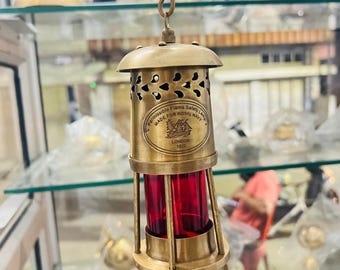 Vintage brass oil lantern with green glass, nautical style decorative lamp inspired by Royal Navy 1920.