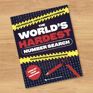 May include: A puzzle book titled The World's Hardest Number Search with a dark blue background featuring rows of numbers, yellow caution tape graphics, a red circle with the text Open At Your Own Risk, and a broken red pencil illustration.