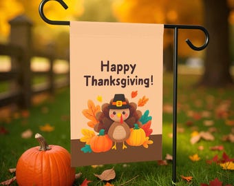 May include: A Thanksgiving garden flag with a cartoon turkey wearing a pilgrim hat, pumpkins, and fall leaves. The flag reads "Happy Thanksgiving!" and is displayed on a black metal stand. An orange pumpkin sits in the foreground.