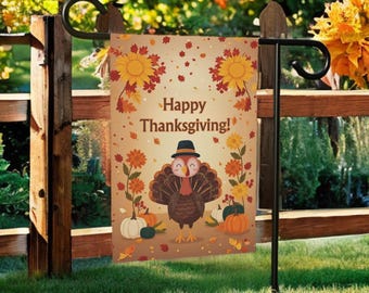 May include: Thanksgiving garden flag featuring a cartoon turkey wearing a hat, surrounded by pumpkins and flowers. The flag has the words "Happy Thanksgiving!" printed on it. The flag is displayed on a black metal stand in a grassy yard.