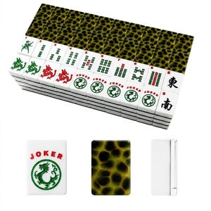 May include: A set of rectangular mahjong tiles featuring a white face with green, red, and black characters, including dragon symbols, numbers, and the word JOKER. The reverse side of each tile displays a dark green and black tortoiseshell pattern.