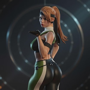 May include: A detailed figurine of a female character in a fighting pose. She wears a black and green sports bra, matching leggings with a white stripe, and a black headband. Her hair is pulled back in a high ponytail.