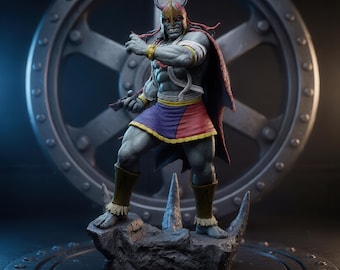 May include: A gray-skinned humanoid action figure with red eyes, wearing a gold horned helmet, a purple and red skirt, and a dark cape. The figure stands on a jagged rock base, featuring muscular arms and legs with tan leg guards and gold arm bands.