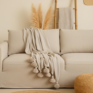Beige plaid with pompoms NunuSol 200x150 cm Moroccan Throw Blanket in cotton, boho chic sofa throw, handmade cocooning blanket