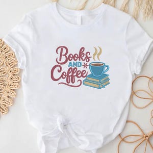 May include: White t-shirt featuring the text "Books and Coffee" in burgundy script. A blue coffee cup with steam sits atop two blue books. The design is a charming illustration for book lovers and coffee enthusiasts.