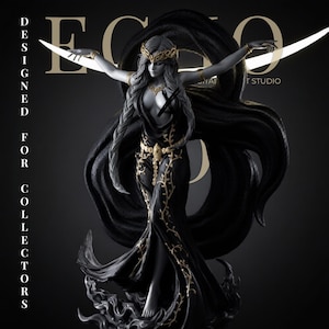 May include: A grey-toned female figurine wearing a long black dress with gold vine patterns, a gold crown, and gold armbands. The figure stands with arms outstretched, framed by a large crescent moon shape. Text reads DESIGNED FOR COLLECTORS.