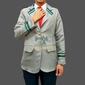 May include: A gray blazer with green and white trim, gold buttons, and a red tie. The blazer has two front pockets and green stripes on the sleeves. The outfit is a cosplay costume.