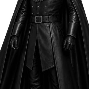 May include: A black leather coat with a matching cape, belt, and gloves. The coat features a buckle belt and button details. The gloves have a cuff design. The outfit is all black.