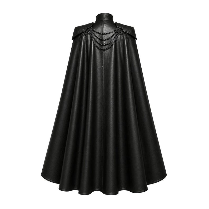 May include: A black faux leather cape with a high collar and shoulder accents. The cape features decorative chain detailing across the upper back. The garment has a flowing, full length design.