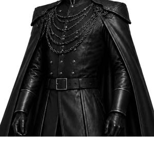 May include: Black leather coat with a cape, featuring a high collar, decorative chain, and a belt with a square buckle. The coat has multiple buttons and fitted sleeves, creating a gothic or steampunk aesthetic.
