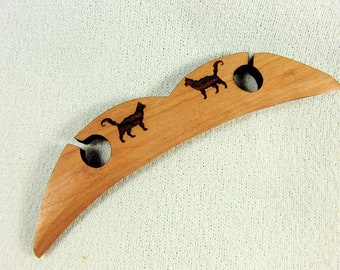 A Short Sword Form Shuttle for Traditional Scandinavian Tape Weaving with Cats 5"