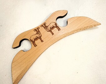 A Short Sword Form Shuttle for Traditional Scandinavian Tape Weaving with Soay Sheep