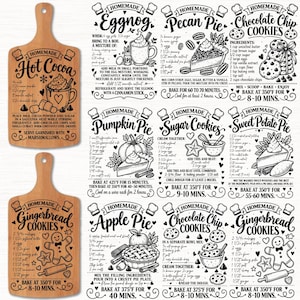 May include: Two wooden cutting boards with laser-engraved recipes for hot cocoa and gingerbread cookies, alongside a collection of printed recipe cards for eggnog, pecan pie, chocolate chip cookies, pumpkin pie, sugar cookies, and sweet potato pie.