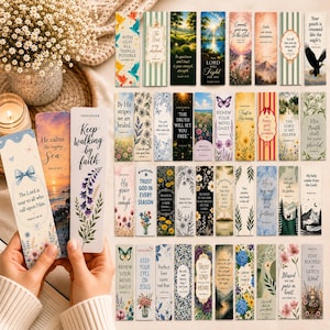 May include: A collection of rectangular paper bookmarks featuring various religious quotes, floral illustrations, landscapes, and wildlife imagery. Each bookmark displays unique text and artistic designs, including depictions of butterflies, mountains, and birds.